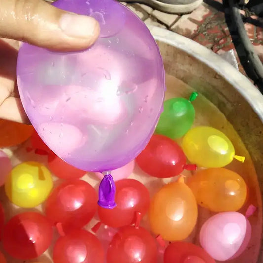 Colorful water balloons with a hand holding a purple one above a bucket of water balloons-Greater Toys Store