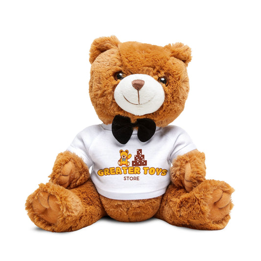 A brown teddy bear with a white t-shirt with Greater Toys store print and black bow tie, sitting upright. Front Facing
