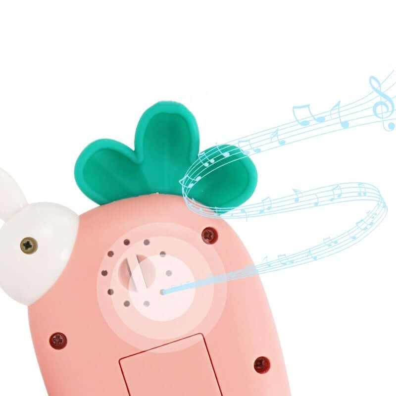 Pink toy with green top and musical notes on a white background-Greater Toys Store