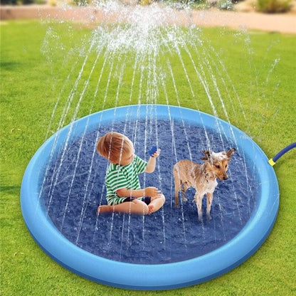 Child and dog playing with a blue inflatable sprinkler pad on grass - Greater Toys Store