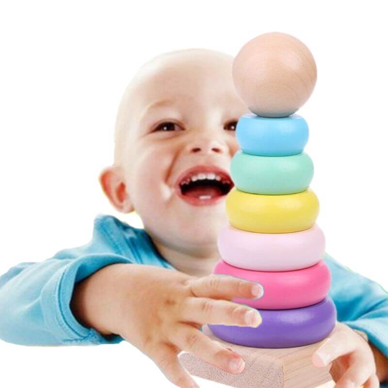 Child playing with a colorful stacking toy on a white background—Greater Toys Store