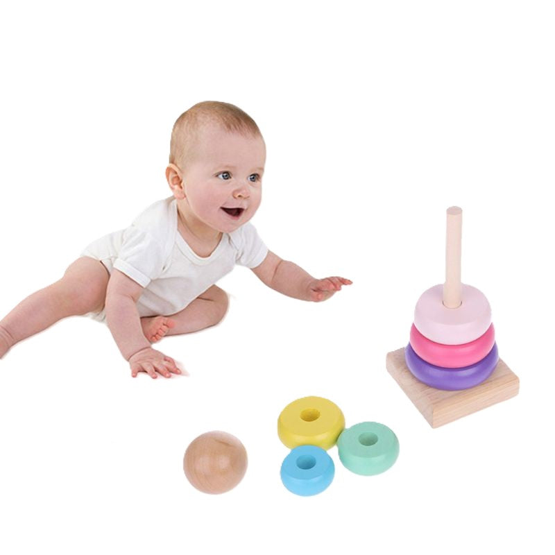 Baby playing with a set of colorful wooden toys on a white background—Greater Toys Store