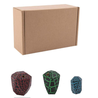 Three colored stacking geometrical wood with cracked surface design in front of a cardboard box on a white background - Greater Toys Store